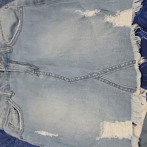 High-Rise S destroyed denim skirt color shown.